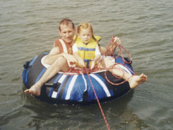 Claire and Jay tubing from the dock.